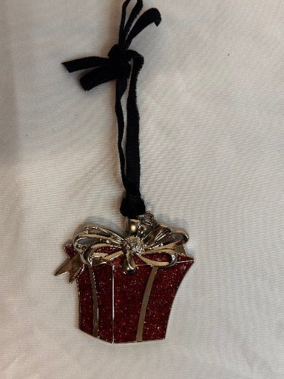 Decorative ribbon with a red glittery bow and black ribbon on a white background