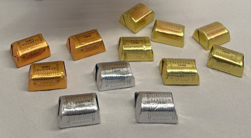 Gold and silver bars on a white background