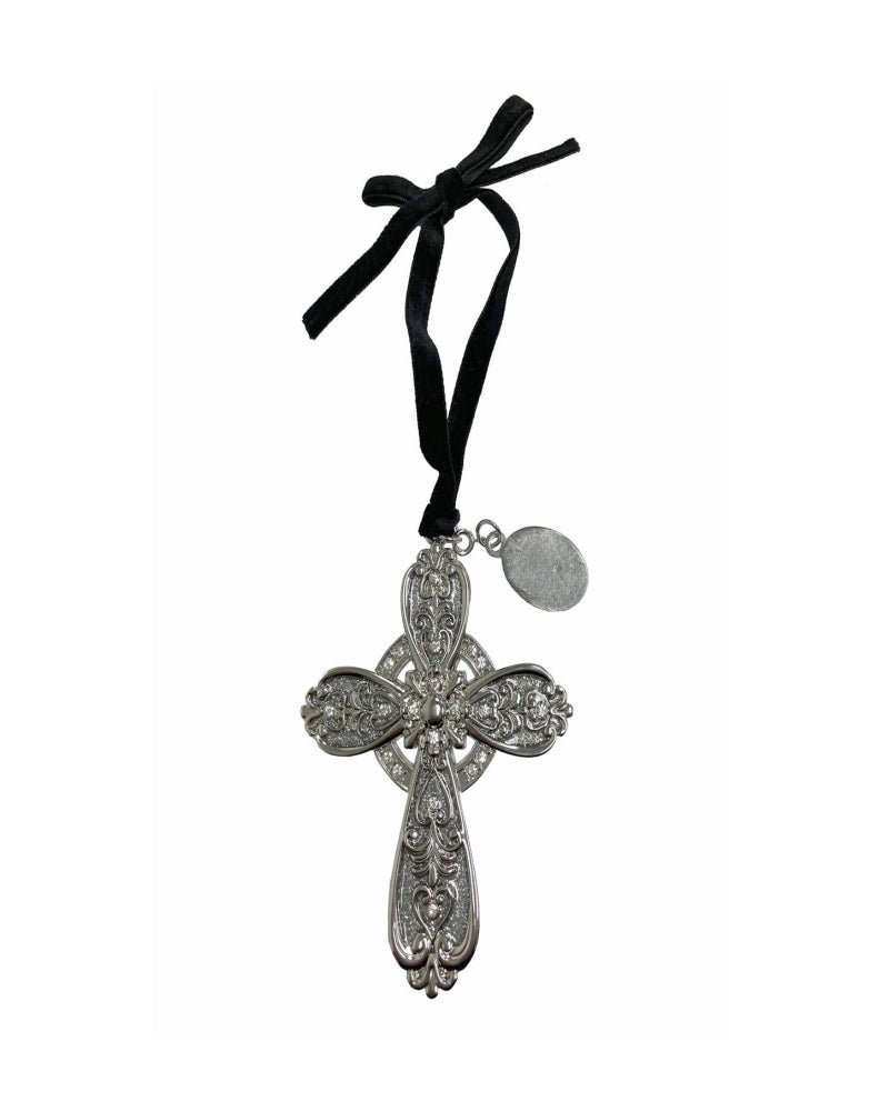 Decorative cross pendant with black ribbon on a white background