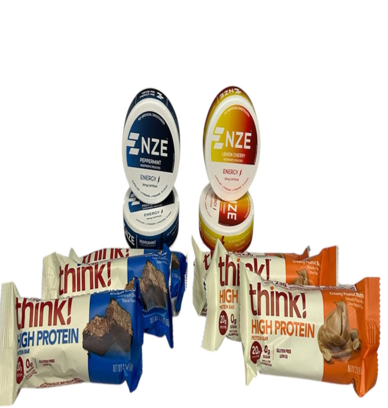Assorted protein bars and ENZE energy balls on a white background