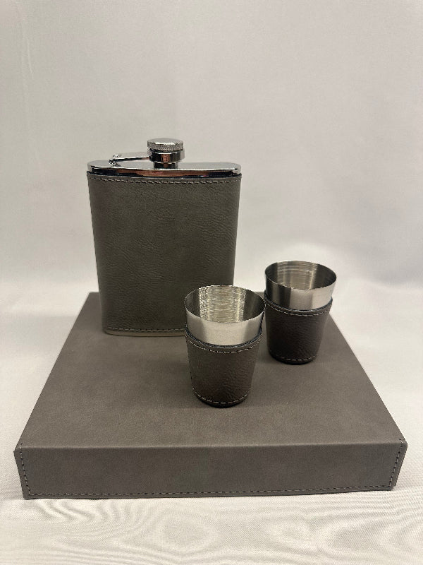 Gray leather flask with two cup holders on a white background