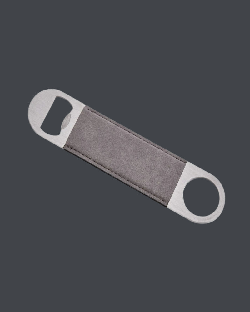 Bottle opener with gray handle and silver ends on a dark gray background