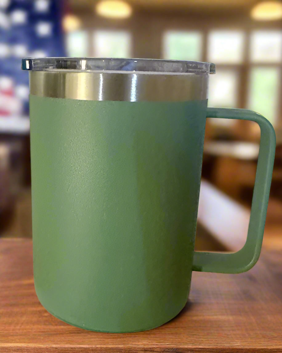Green mug with a silver lid on a white box