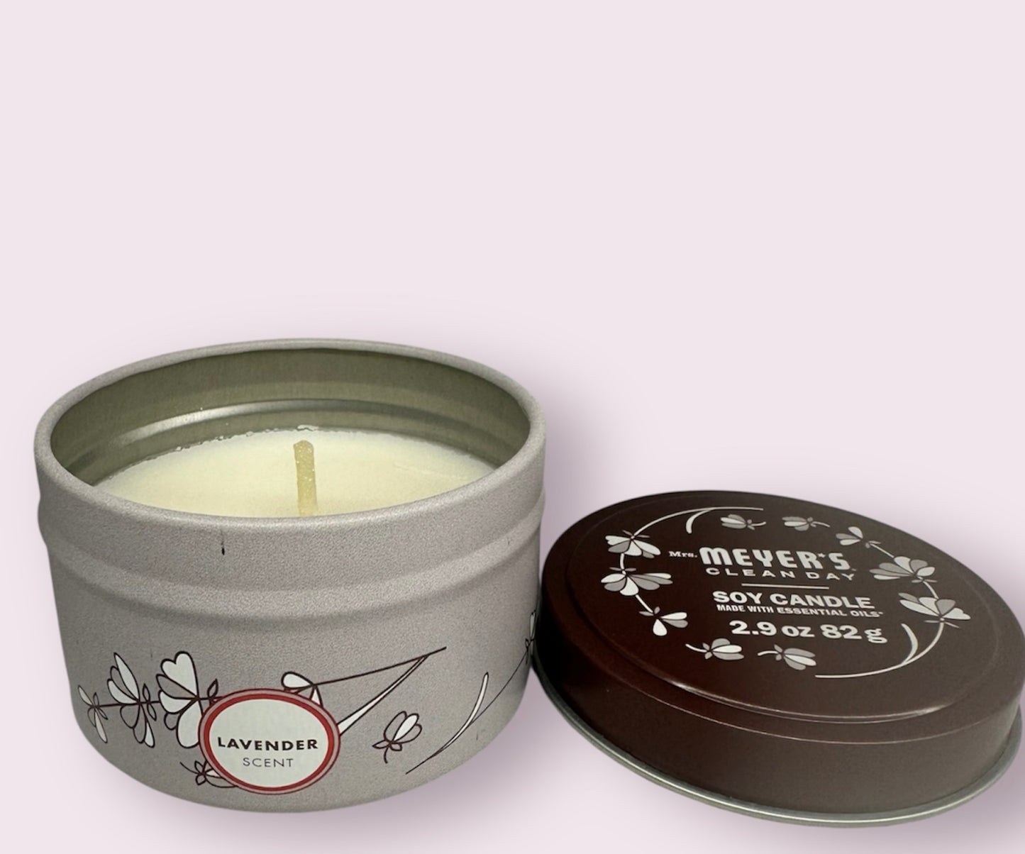 Meyer's soy candle in a gray tin with lid on a white background