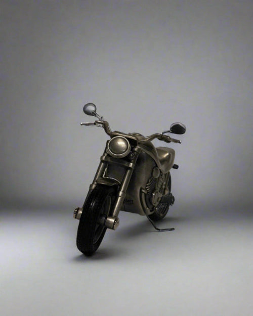 Metallic motorcycle model on a gray background