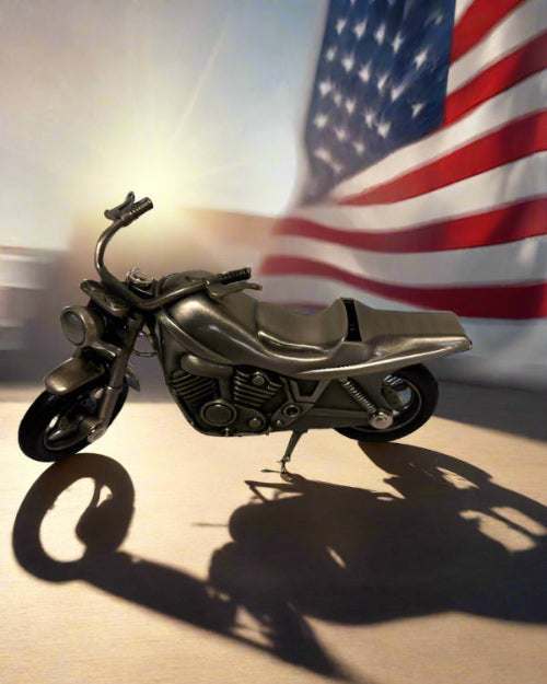 Bronze motorcycle model on a gray background