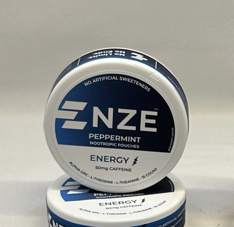Two containers of NZE Peppermint Nootropic Pouches on a gray background