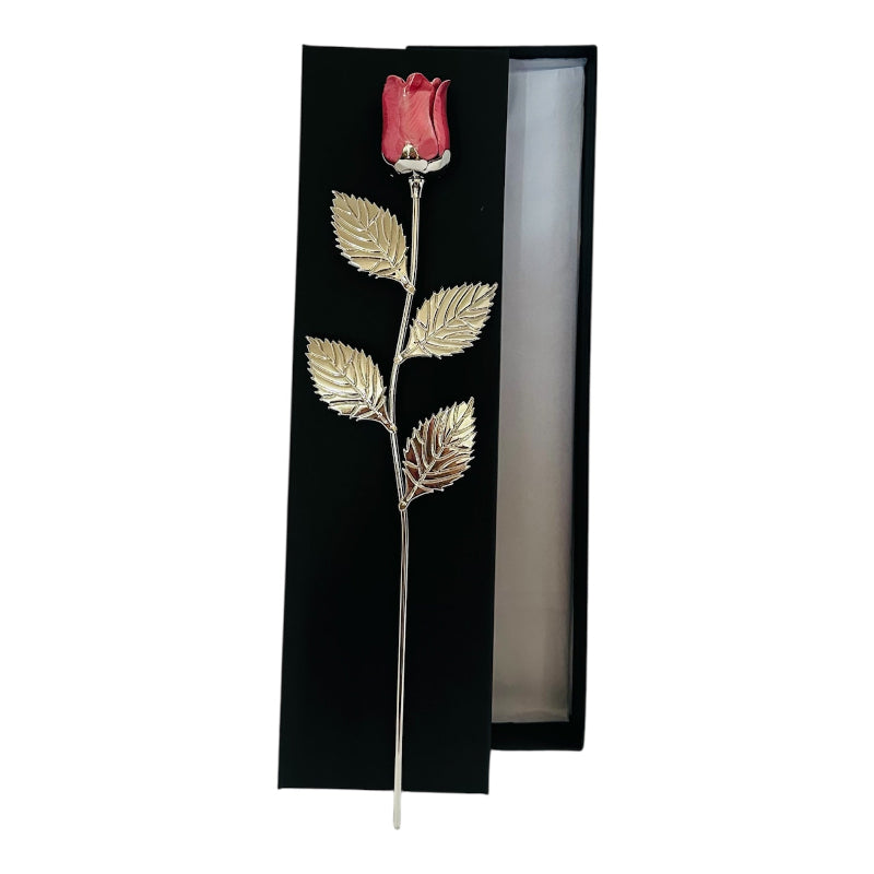 Decorative red rose with gold leaves in a black gift box