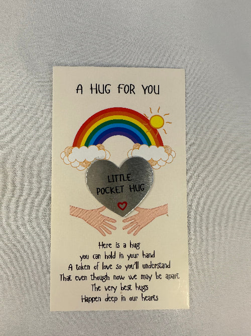 Card with rainbow, cloud, and heart design on a gray background