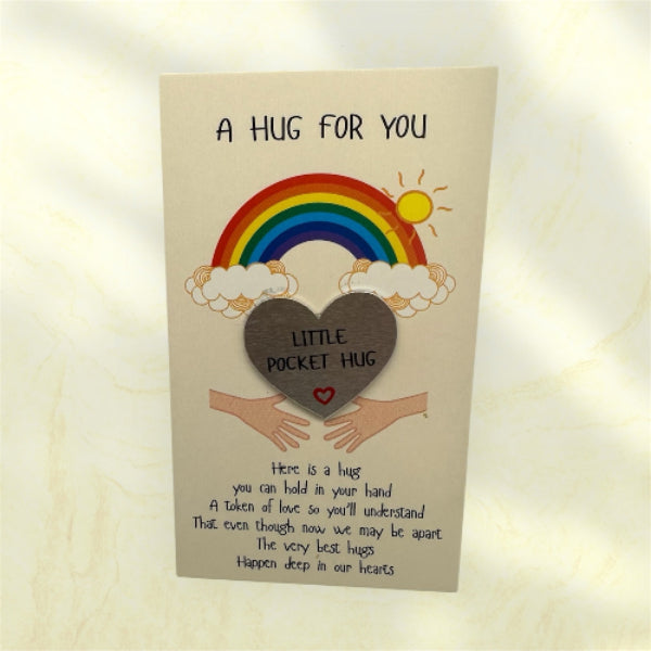 Card with a rainbow, heart, and text on a beige background