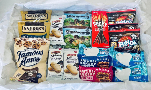 Assorted snack packages including Snyder's, Milano, Chocorooms, and others on a white background