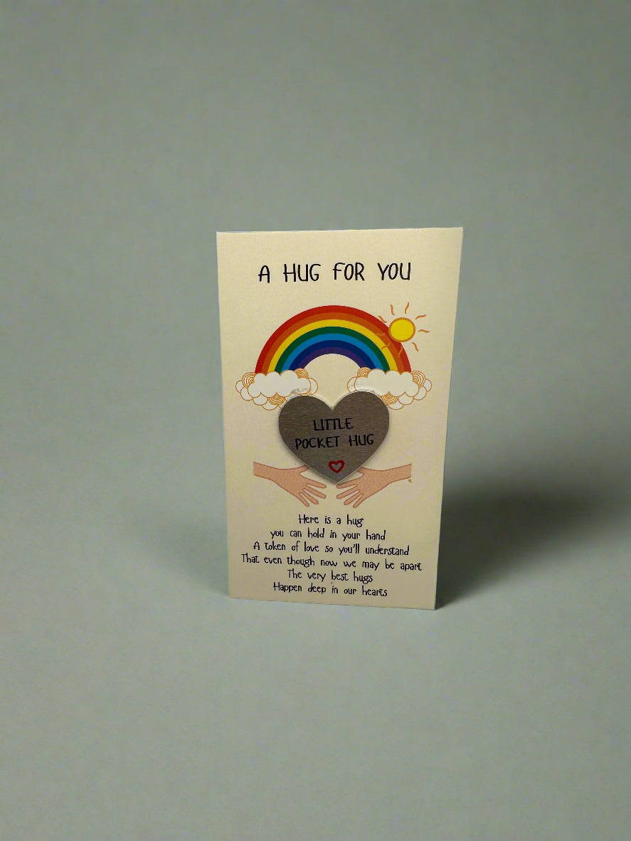 Card with a rainbow, heart, and text on a gray background