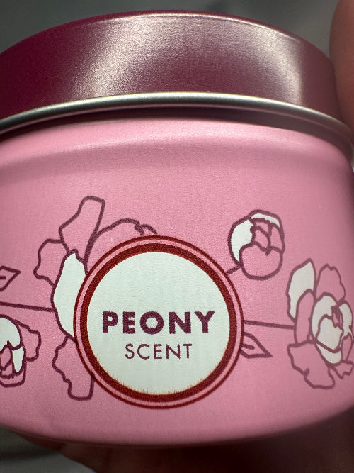 Pink container with floral design and 'Peony Scent' label