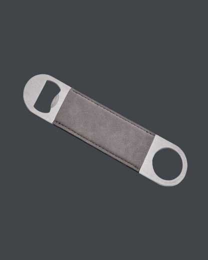 Bottle opener with gray handle and silver ends on a dark gray background