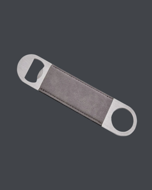 Bottle opener with gray handle and silver ends on a dark gray background