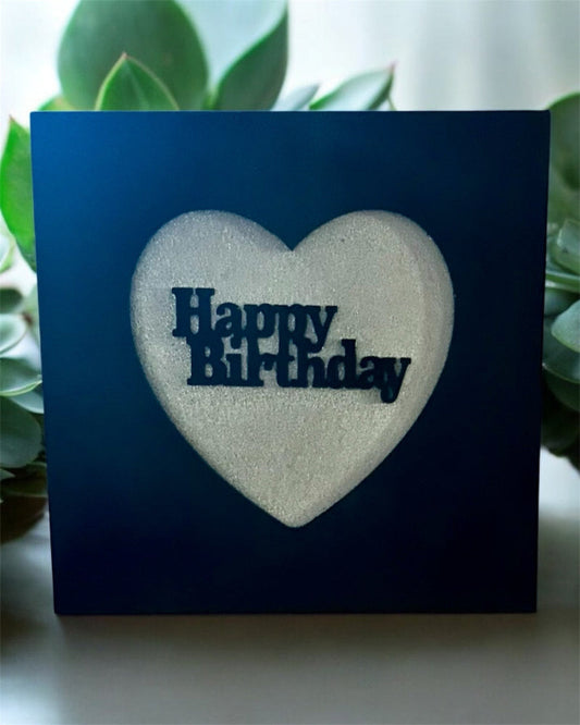 Black Heart Frame with a white heart-shaped cutout displaying 'Happy Birthday' text, surrounded by green 