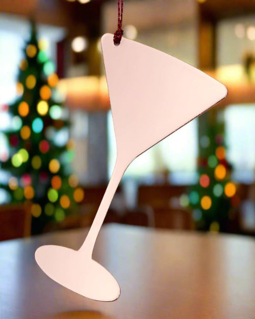 Decorative pink triangle-shaped ornament on a white background