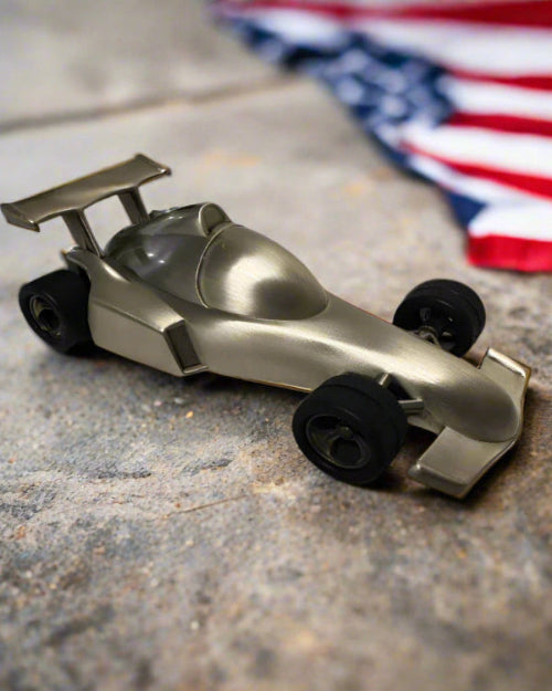 Metallic model of a racing car on a gradient background