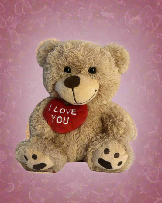 Plush teddy bear with a heart saying 'I Love You' on a purple background